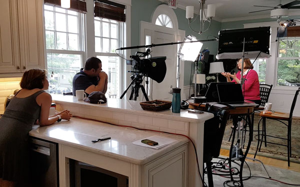 Cameras crew in a home filming