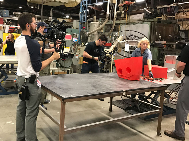 Factory Training Video Videographers filming in a factory
